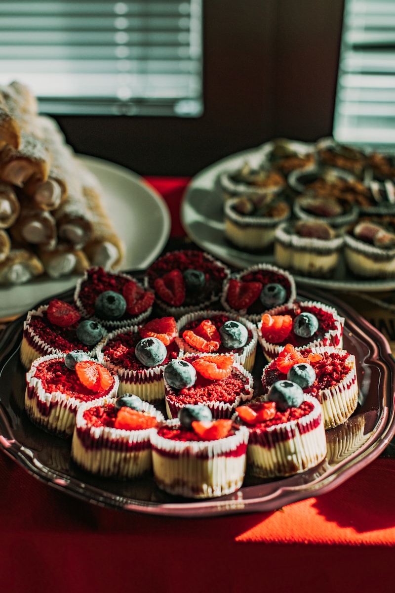 a table topped with lots of desserts and pastries